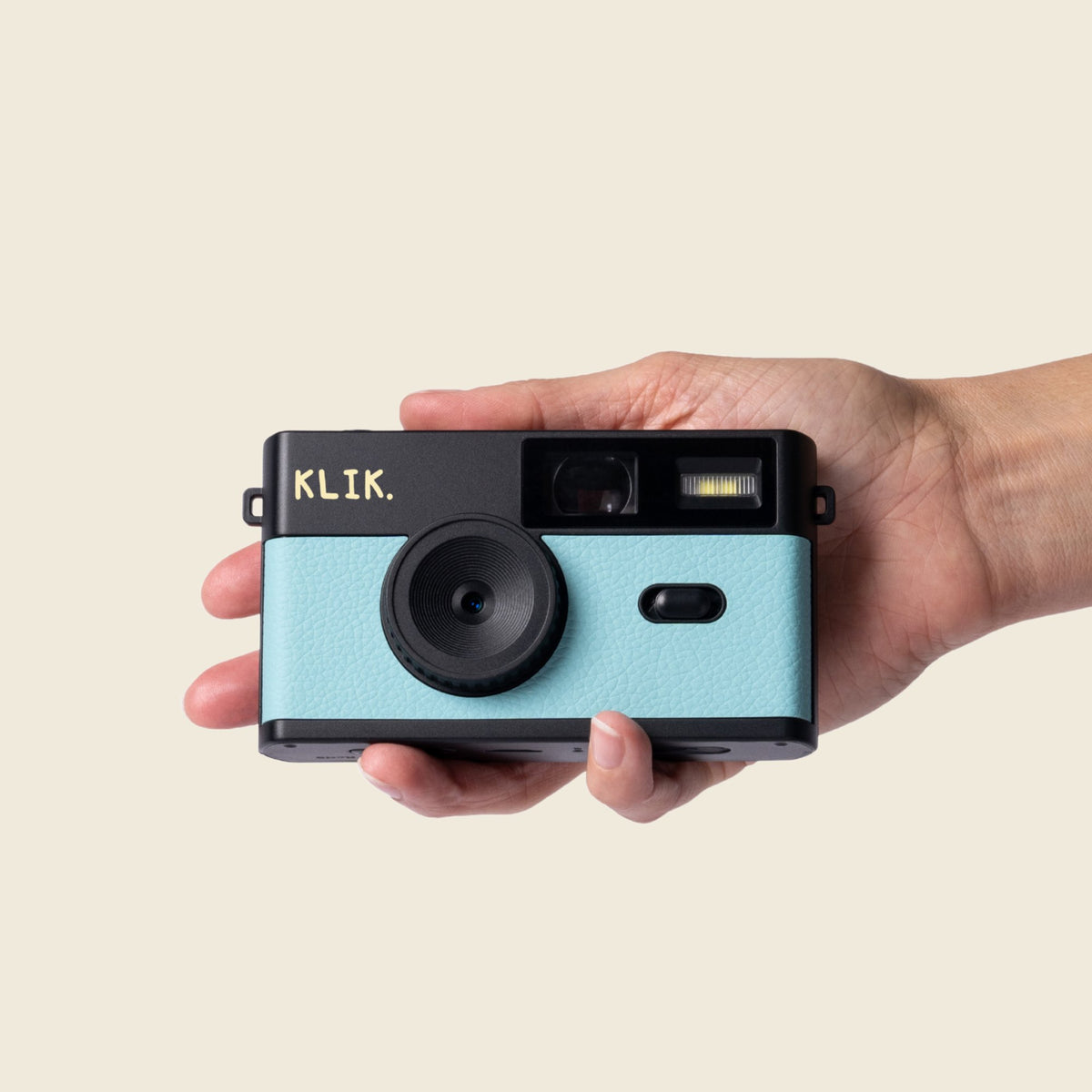 Blue KLIK camera in hand